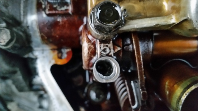 What can my solution be with Its one of the hold down bolt holes for the valve cover