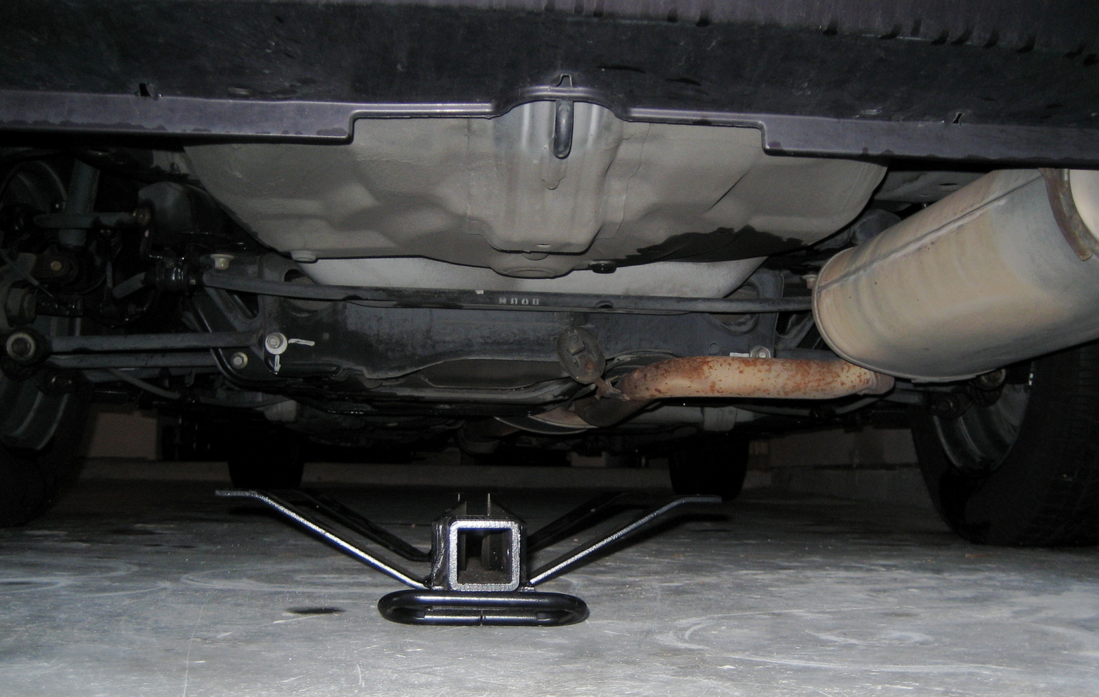 What parts of a car is it safe to put a tow hook without damaging my car and other parts - 1